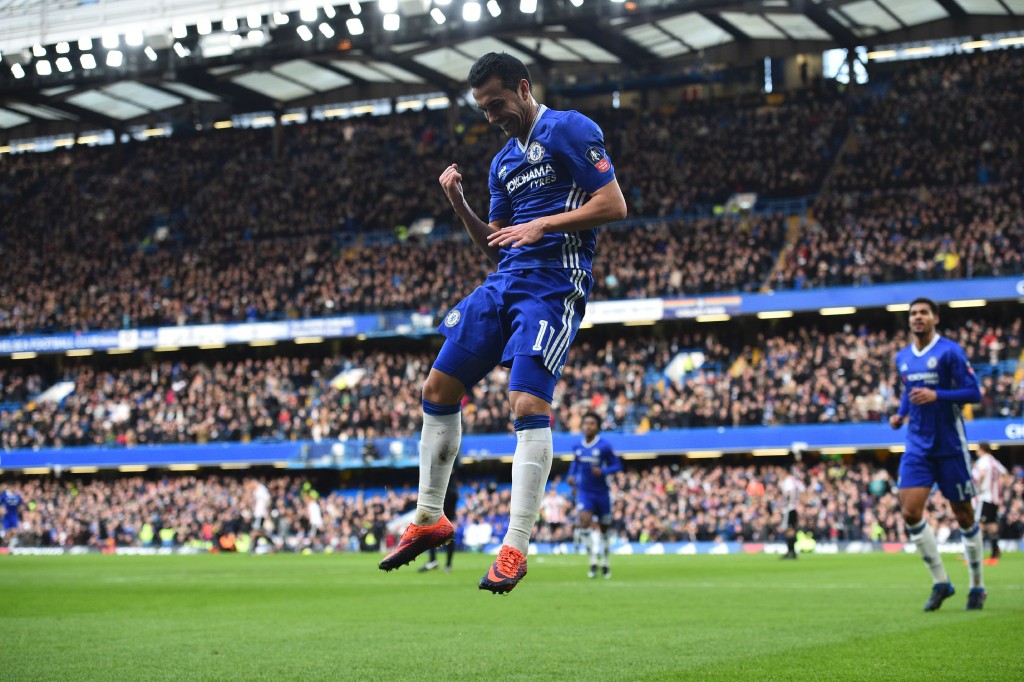Chelsea's Spanish midfielder Pedro celebrates scoring their second goal during the English FA Cup fourth round football match between Chelsea and Brentford at Stamford Bridge in London on January 28, 2017. / AFP / Glyn KIRK / RESTRICTED TO EDITORIAL USE. No use with unauthorized audio, video, data, fixture lists, club/league logos or 'live' services. Online in-match use limited to 75 images, no video emulation. No use in betting, games or single club/league/player publications. / (Photo credit should read GLYN KIRK/AFP/Getty Images)