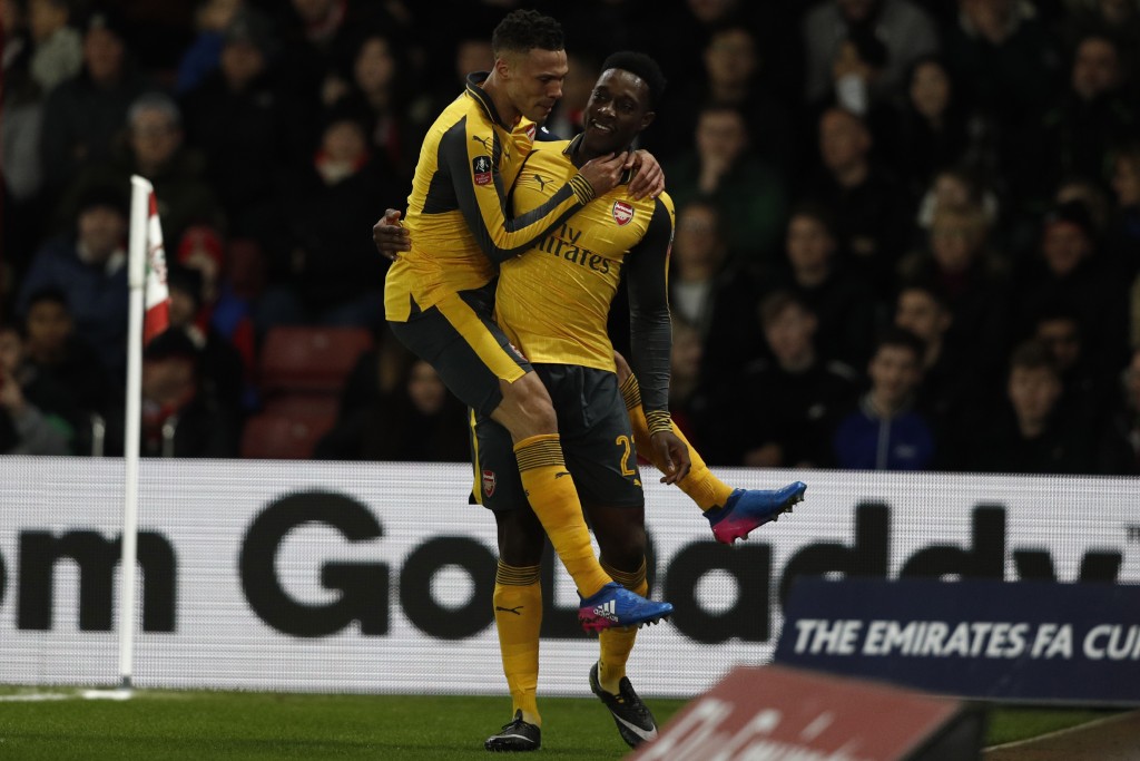 Arsenal's English striker Danny Welbeck (R) celebrates scoring his team's first goal with Arsenal's English defender Kieran Gibbs during the English FA Cup fourth round football match between Southampton and Arsenal at St Mary's in Southampton, southern England on January 28, 2017. / AFP / Adrian DENNIS / RESTRICTED TO EDITORIAL USE. No use with unauthorized audio, video, data, fixture lists, club/league logos or 'live' services. Online in-match use limited to 75 images, no video emulation. No use in betting, games or single club/league/player publications. / (Photo credit should read ADRIAN DENNIS/AFP/Getty Images)