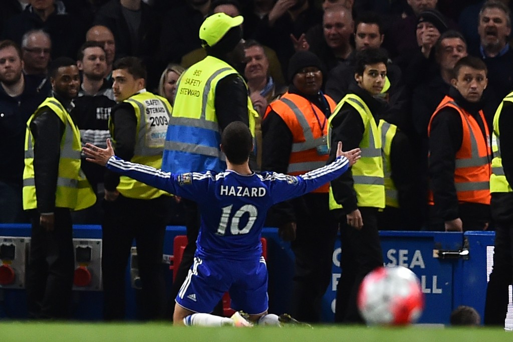 Chelsea's Belgian midfielder Eden Hazard celebrates scoring their second goal to level the score at 2-2 during the English Premier League football match between Chelsea and Tottenham Hotspur at Stamford Bridge in London on May 2, 2016. / AFP / BEN STANSALL / RESTRICTED TO EDITORIAL USE. No use with unauthorized audio, video, data, fixture lists, club/league logos or 'live' services. Online in-match use limited to 75 images, no video emulation. No use in betting, games or single club/league/player publications. / (Photo credit should read BEN STANSALL/AFP/Getty Images)