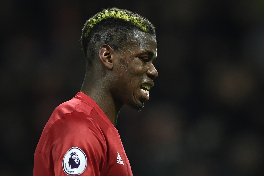 Manchester United's French midfielder Paul Pogba gestures as he leaves the pitch after the English Premier League football match between Manchester United and Liverpool at Old Trafford in Manchester, north west England, on January 15, 2017. The game finished 1-1.Paul Pogba stood to be United's fall guy at Old Trafford after conceding a soft first-half penalty for handball, which James Milner converted, only for Ibrahimovic to save his blushes. / AFP / Oli SCARFF / RESTRICTED TO EDITORIAL USE. No use with unauthorized audio, video, data, fixture lists, club/league logos or 'live' services. Online in-match use limited to 75 images, no video emulation. No use in betting, games or single club/league/player publications. / (Photo credit should read OLI SCARFF/AFP/Getty Images)