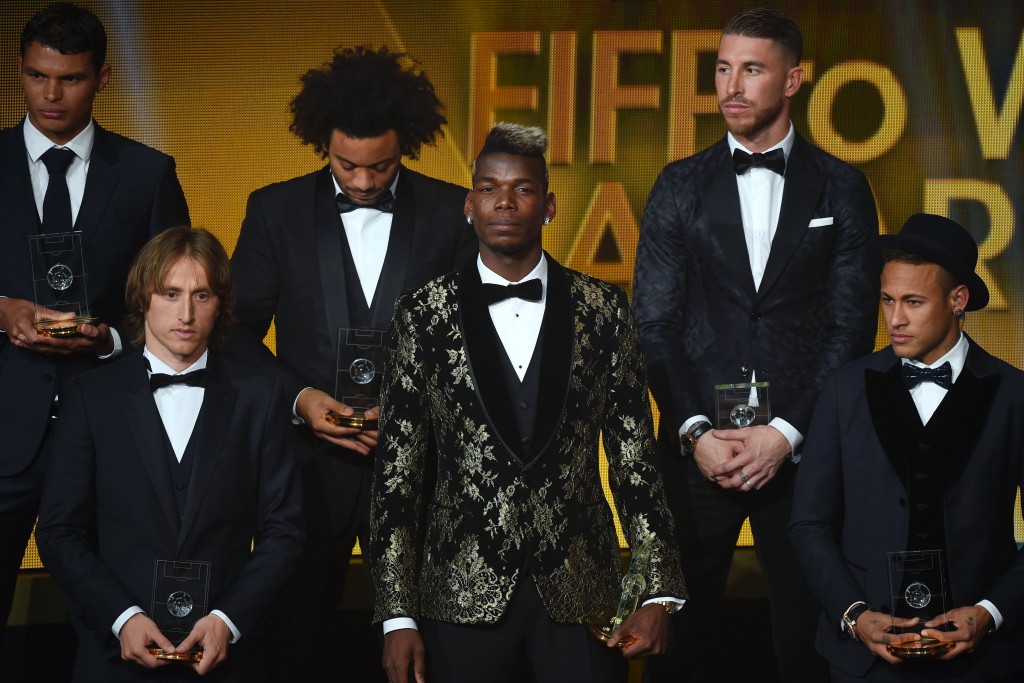 (From L) Brazil and Paris Saint-Germain defender Thiago Silva, Croatia and Real Madrid midfielder Luka Modric, Brazil and Real Madrid defender Marcelo, France and Juventus midfielder Paul Pogba, Spain and Real Madrid defender Sergio Ramos and Brazil and FC Barcelona forward Neymar pose on stage after being selected in the 2015 FIFA FIFPro World XI during the 2015 FIFA Ballon d'Or award ceremony at the Kongresshaus in Zurich on January 11, 2016. AFP PHOTO / OLIVIER MORIN / AFP / OLIVIER MORIN (Photo credit should read OLIVIER MORIN/AFP/Getty Images)