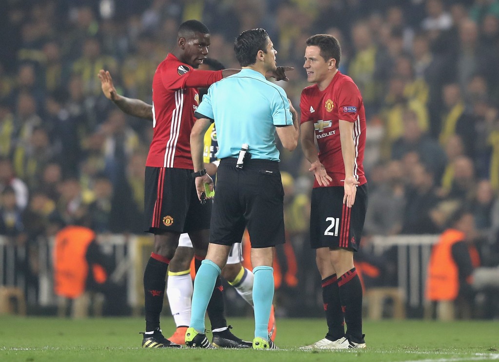 ISTANBUL, TURKEY - NOVEMBER 03: Ander Herrera and Paul Pogba of Manchester United speak to the referee during the UEFA Europa League Group A match between Fenerbahce SK and Manchester United FC at Sukru Saracoglu Stadium on November 3, 2016 in Istanbul, Turkey. (Photo by Chris McGrath/Getty Images)