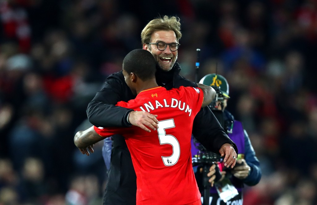 LIVERPOOL, ENGLAND - DECEMBER 31: Georginio Wijnaldum of Liverpool and Jurgen Klopp, Manager of Liverpool celebrate victory during the Premier League match between Liverpool and Manchester City at Anfield on December 31, 2016 in Liverpool, England. (Photo by Clive Brunskill/Getty Images)