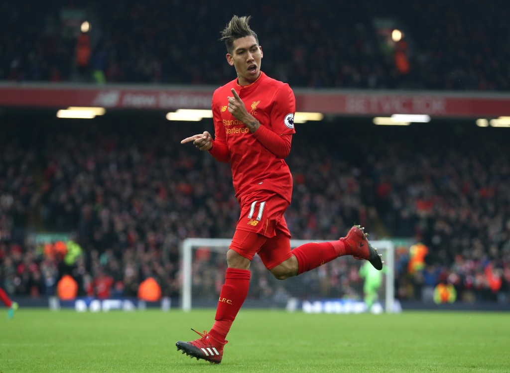 LIVERPOOL, ENGLAND - JANUARY 21: Roberto Firmino of Liverpool celebrates scoring his sides second goal during the Premier League match between Liverpool and Swansea City at Anfield on January 21, 2017 in Liverpool, England. (Photo by Julian Finney/Getty Images)