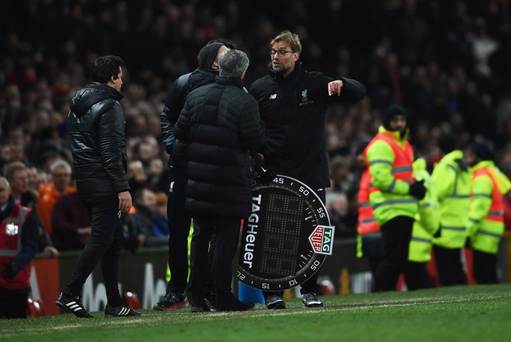 MANCHESTER, ENGLAND - JANUARY 15: Jose Mourinho manager of Manchester United and Jurgen Klopp manager of Liverpool argue on the touchline the Premier League match between Manchester United and Liverpool at Old Trafford on January 15, 2017 in Manchester, England. (Photo by Laurence Griffiths/Getty Images)