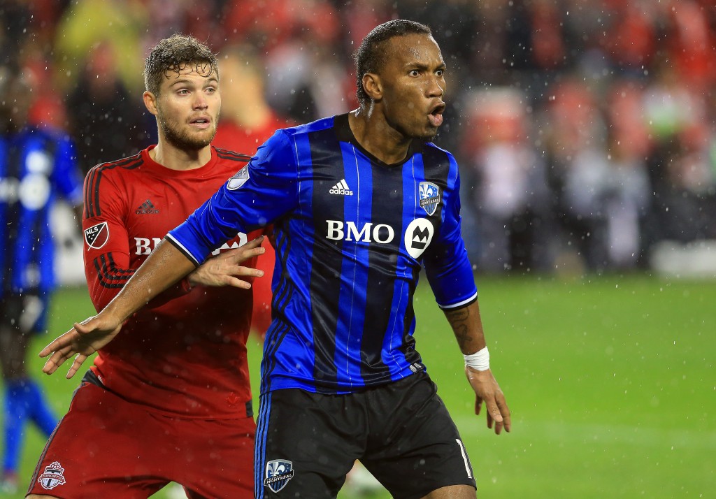 TORONTO, ON - NOVEMBER 30: Didier Drogba #11 of Montreal Impact battles with Eriq Zavaleta #15 of Toronto FC during the MLS Eastern Conference Final, Leg 2 game at BMO Field on November 30, 2016 in Toronto, Ontario, Canada. (Photo by Vaughn Ridley/Getty Images)
