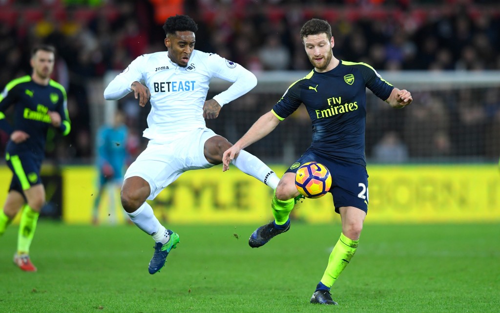 SWANSEA, WALES - JANUARY 14: Leroy Fer of Swansea City battles with Shkodran Mustafi of Arsenal during the Premier League match between Swansea City and Arsenal at Liberty Stadium on January 14, 2017 in Swansea, Wales. (Photo by Stu Forster/Getty Images)