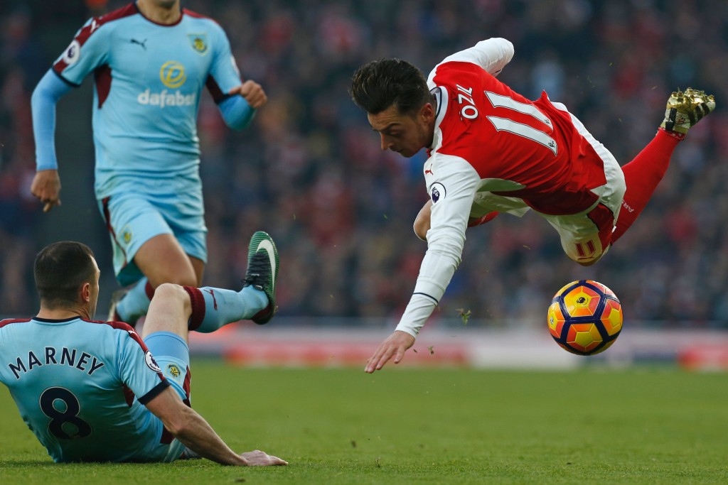 Arsenal's title challenge, a-la Ozil in the image, seems to be faltering, again. (Picture Courtesy - AFP/Getty Images)