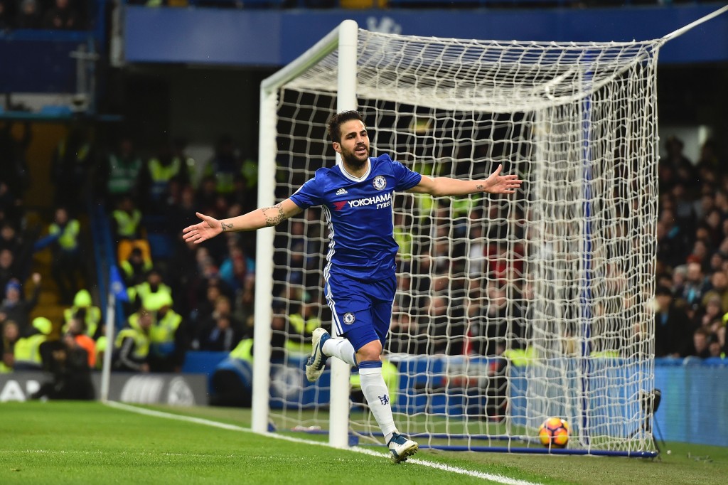 Chelsea's Spanish midfielder Cesc Fabregas celebrates scoring the opening goal during the English Premier League football match between Chelsea and Swansea at Stamford Bridge in London on February 25, 2017. / AFP / Glyn KIRK / RESTRICTED TO EDITORIAL USE. No use with unauthorized audio, video, data, fixture lists, club/league logos or 'live' services. Online in-match use limited to 75 images, no video emulation. No use in betting, games or single club/league/player publications. / (Photo credit should read GLYN KIRK/AFP/Getty Images)
