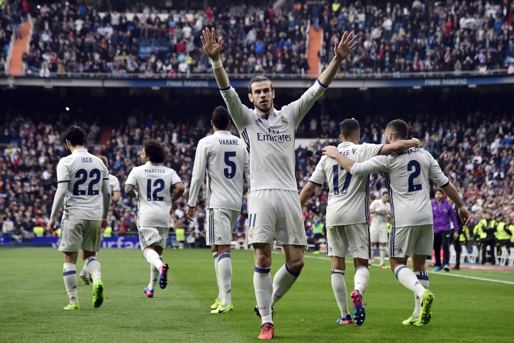 Real Madrid's Welsh forward Gareth Bale celebrates a goal during the Spanish league football match Real Madrid CF vs RCD Espanyol at the Santiago Bernabeu stadium in Madrid on February 18, 2017. / AFP / JAVIER SORIANO (Photo credit should read JAVIER SORIANO/AFP/Getty Images)