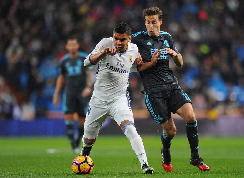 MADRID, SPAIN - JANUARY 29: Henrique Casemiro of Real Madrid is tackled by Sergio Canales of Real Sociedad de Futbol during the La Liga match between Real Madrid CF and Real Sociedad de Futbol at the Bernabeu on January 29, 2017 in Madrid, Spain. (Photo by Denis Doyle/Getty Images)