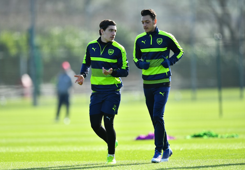ST ALBANS, ENGLAND - MARCH 06: Hector Bellerin (L) and Mesut Oezul of Arsenal warm up during a training session at London Colney on March 6, 2017 in St Albans, England. (Photo by Dan Mullan/Getty Images)
