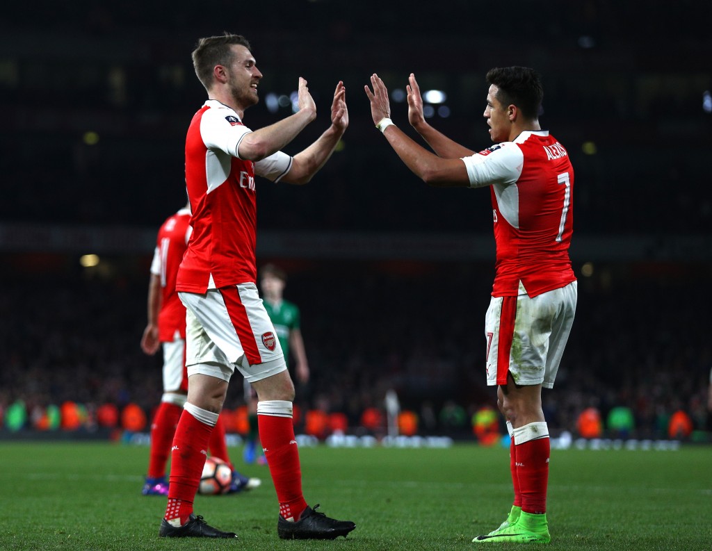 LONDON, ENGLAND - MARCH 11: Aaron Ramsey of Arsenal (L) celebrates scoring his sides fifth goal with Alexis Sanchez of Arsenal (R) during The Emirates FA Cup Quarter-Final match between Arsenal and Lincoln City at Emirates Stadium on March 11, 2017 in London, England. (Photo by Ian Walton/Getty Images)
