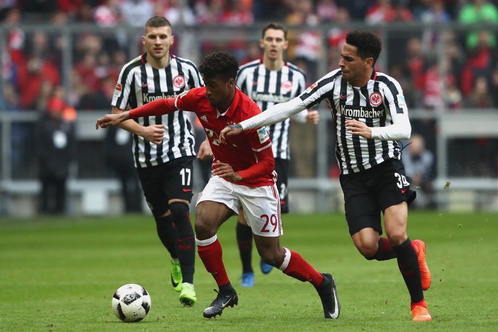 MUNICH, GERMANY - MARCH 11: Omar Mascarell (R) of Frankfurt battles for the ball with Kingsley Coman (C) of Muenchen during the Bundesliga match between Bayern Muenchen and Eintracht Frankfurt at Allianz Arena on March 11, 2017 in Munich, Germany. (Photo by Alexander Hassenstein/Bongarts/Getty Images)