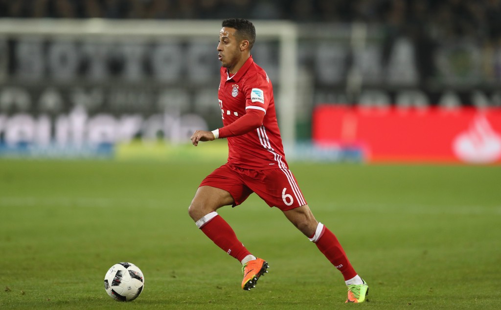 MOENCHENGLADBACH, GERMANY - MARCH 19: Thiago of Bayern Muenchen runs with the ball during the Bundesliga match between Borussia Moenchengladbach and Bayern Muenchen at Borussia-Park on March 19, 2017 in Moenchengladbach, Germany. (Photo by Lars Baron/Bongarts/Getty Images)