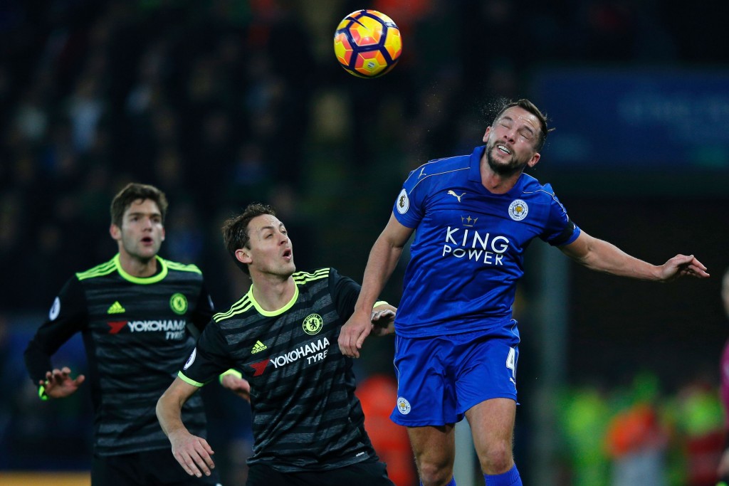 Leicester City's English midfielder Danny Drinkwater (R) wins a header as Chelsea's Spanish defender Marcos Alonso and Chelsea's Serbian midfielder Nemanja Matic (C) look on during the English Premier League football match between Leicester City and Chelsea at King Power Stadium in Leicester, central England on January 14, 2017. / AFP / Adrian DENNIS / RESTRICTED TO EDITORIAL USE. No use with unauthorized audio, video, data, fixture lists, club/league logos or 'live' services. Online in-match use limited to 75 images, no video emulation. No use in betting, games or single club/league/player publications. / (Photo credit should read ADRIAN DENNIS/AFP/Getty Images)
