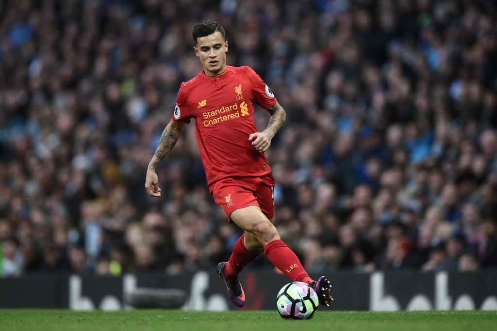 Liverpool's Brazilian midfielder Philippe Coutinho runs with the ball during the English Premier League football match between Manchester City and Liverpool at the Etihad Stadium in Manchester, north west England, on March 19, 2017. / AFP PHOTO / Oli SCARFF / RESTRICTED TO EDITORIAL USE. No use with unauthorized audio, video, data, fixture lists, club/league logos or 'live' services. Online in-match use limited to 75 images, no video emulation. No use in betting, games or single club/league/player publications. / (Photo credit should read OLI SCARFF/AFP/Getty Images)