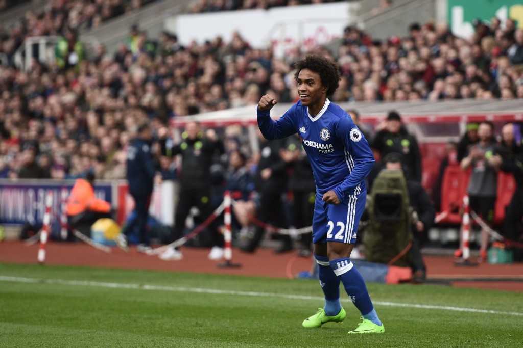Chelsea's Brazilian midfielder Willian celebrates after scoring during the English Premier League football match between Stoke City and Chelsea at the Bet365 Stadium in Stoke-on-Trent, central England on March 18, 2017. / AFP PHOTO / Oli SCARFF / RESTRICTED TO EDITORIAL USE. No use with unauthorized audio, video, data, fixture lists, club/league logos or 'live' services. Online in-match use limited to 75 images, no video emulation. No use in betting, games or single club/league/player publications. / (Photo credit should read OLI SCARFF/AFP/Getty Images)
