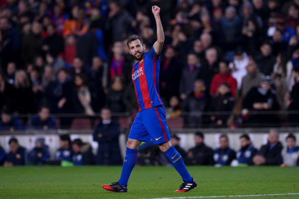 Barcelona's defender Jordi Alba celebrates his goal during the Spanish league football match FC Barcelona vs RCD Espanyol at the Camp Nou stadium in Barcelona on December 18, 2016. / AFP / JOSEP LAGO (Photo credit should read JOSEP LAGO/AFP/Getty Images)