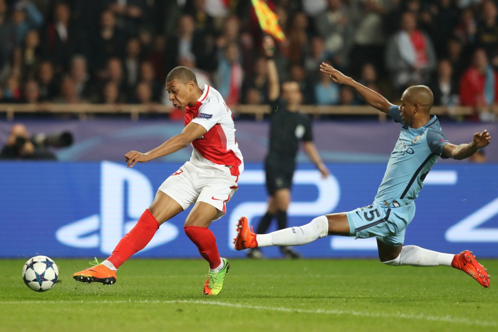 Monaco's French forward Kylian Mbappe Lottin (L) challenges Manchester City's Brazilian midfielder Fernandinho during the UEFA Champions League round of 16 football match between Monaco and Manchester City at the Stade Louis II in Monaco on March 15, 2017. / AFP PHOTO / Valery HACHE (Photo credit should read VALERY HACHE/AFP/Getty Images)