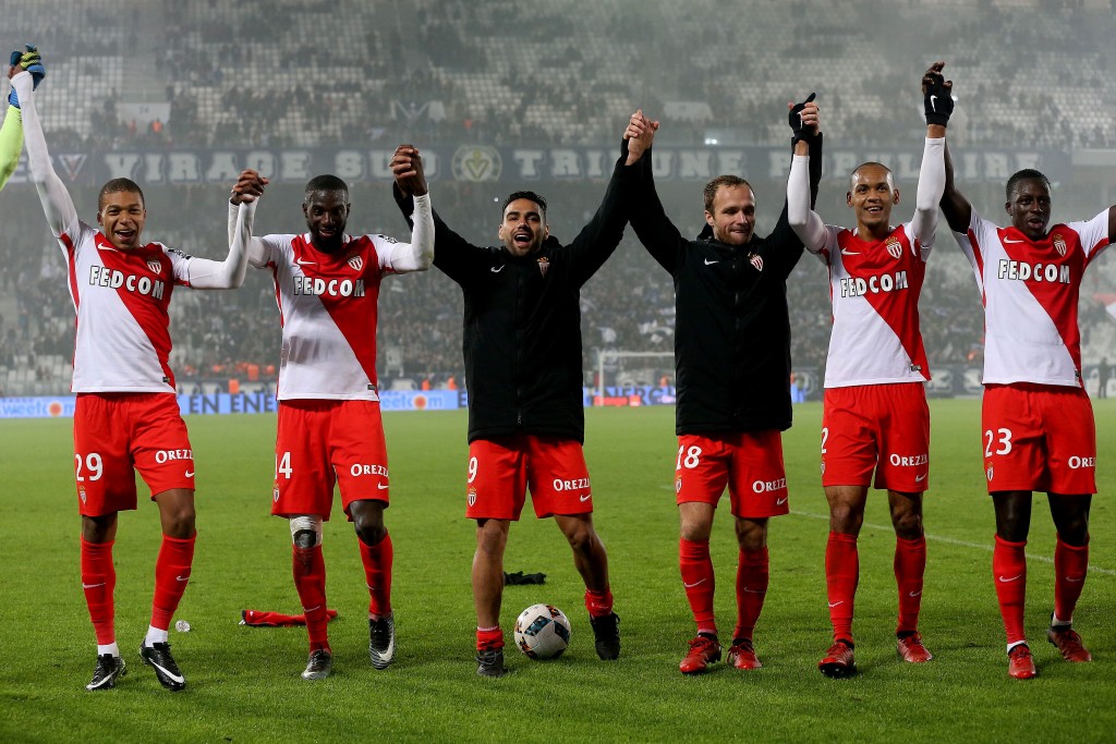 (L to R) Monaco's French forward Kylian Mbappe, Monaco's French midfielder Tiemoue Bakayoko, Monaco's Colombian forward Radamel Falcao, Monaco's French forward Valere Germain, Monaco's Brazilian defender Fabinho and Monaco's French defender Benjamin Mendy celebrate at the end of the French L1 football match Bordeaux vs Monaco on December 10, 2013 at the Matmut Atlantique Stadium in Bordeaux. / AFP / ROMAIN PERROCHEAU (Photo credit should read ROMAIN PERROCHEAU/AFP/Getty Images)