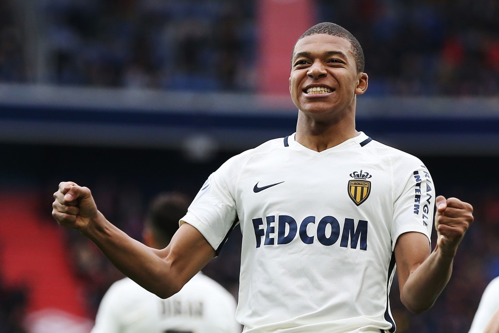 Monaco's French forward Kylian Mbappe Lottin celebrates after scoring a goal during the French L1 football match between Caen (SMC) and Monaco (AS), on March 19, 2017 at the Michel d'Ornano stadium, in Caen, northwestern France. / AFP PHOTO / CHARLY TRIBALLEAU (Photo credit should read CHARLY TRIBALLEAU/AFP/Getty Images)
