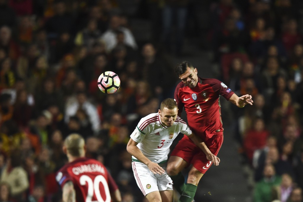 Portugal's defender Pepe (R) heads the ball with Hungary's defender Mihaly Korhut (C) during the WC 2018 group B football qualifing match Portugal vs Hungary at the Luz stadium in Lisbon on March 25, 2017. / AFP PHOTO / PATRICIA DE MELO MOREIRA (Photo credit should read PATRICIA DE MELO MOREIRA/AFP/Getty Images)