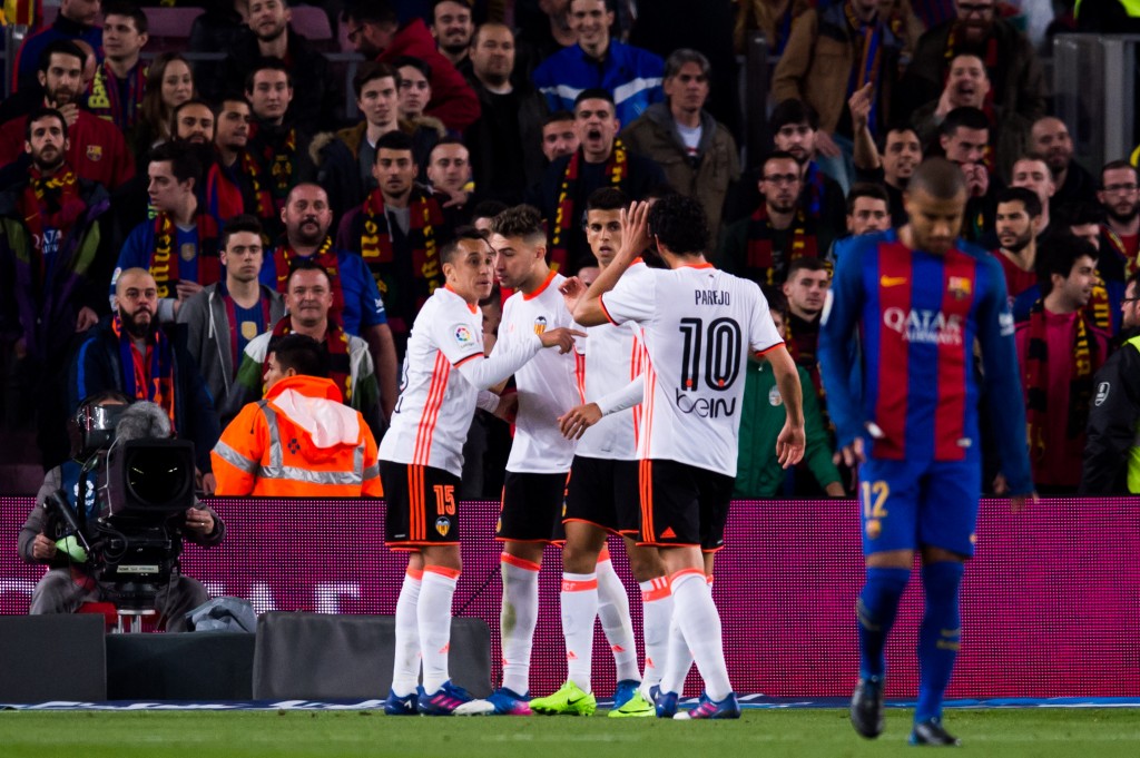 BARCELONA, SPAIN - MARCH 19: Munir El Haddadi (2nd L) of Valencia CF celebrates with his teammates Fabian Orellana (L), Joao Cancelo (3rd L) and Dani Parejo (4th L) after scoring his team's second goal during the La Liga match between FC Barcelona and Valencia CF at Camp Nou stadium on March 19, 2017 in Barcelona, Spain. (Photo by Alex Caparros/Getty Images)