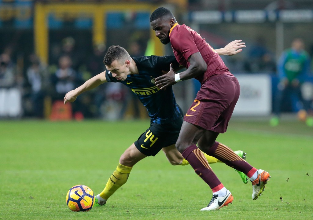 MILAN, ITALY - FEBRUARY 26: Ivan Perisic of FC Internazionale Milano (L) competes for the ball with Antonio Rudiger of AS Roma during the Serie A match between FC Internazionale and AS Roma at Stadio Giuseppe Meazza on February 26, 2017 in Milan, Italy. (Photo by Emilio Andreoli/Getty Images )