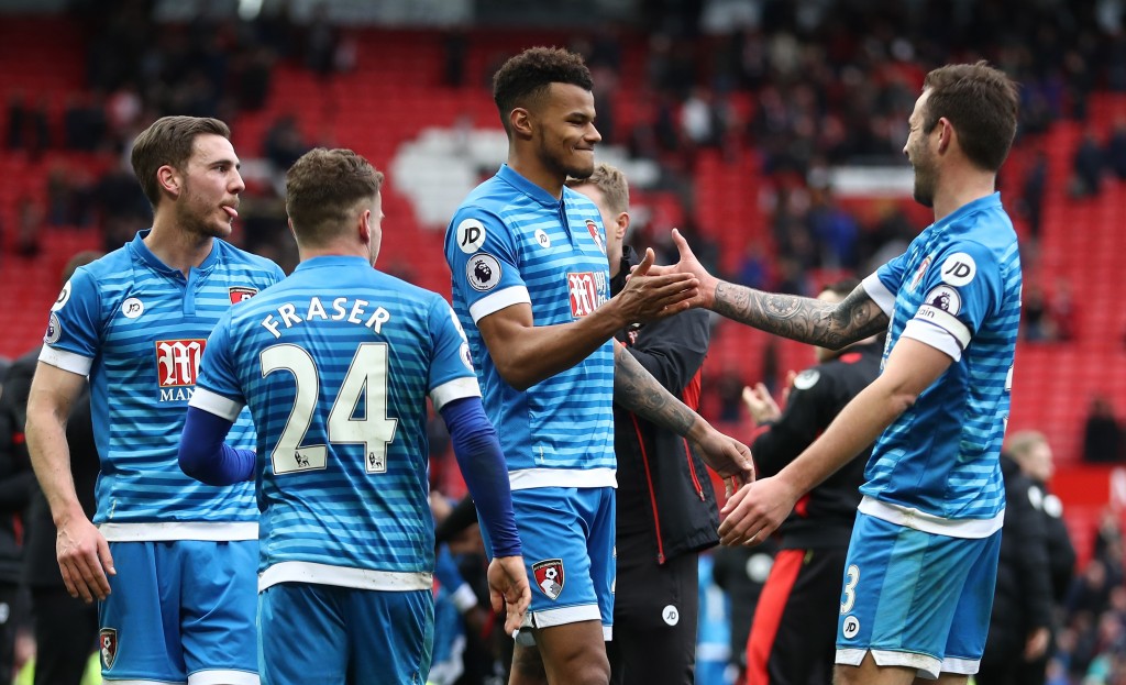 MANCHESTER, ENGLAND - MARCH 04: Tyrone Mings of AFC Bournemouth (C) celebrates with Steve Cook of AFC Bournemouth (R) after the Premier League match between Manchester United and AFC Bournemouth at Old Trafford on March 4, 2017 in Manchester, England. (Photo by Julian Finney/Getty Images)