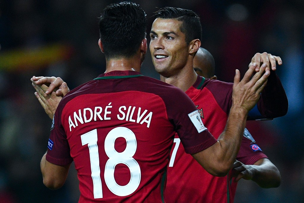 AVEIRO, PORTUGAL - OCTOBER 07: Cristiano Ronaldo of Portugal celebrates with his team mate Andre Silva after scoring his team's fourth goal during the FIFA 2018 World Cup Qualifier between Portugal and Andorra at Estadio Municipal de Aveiro on October 7, 2016 in Aveiro, Portugal. (Photo by David Ramos/Getty Images)