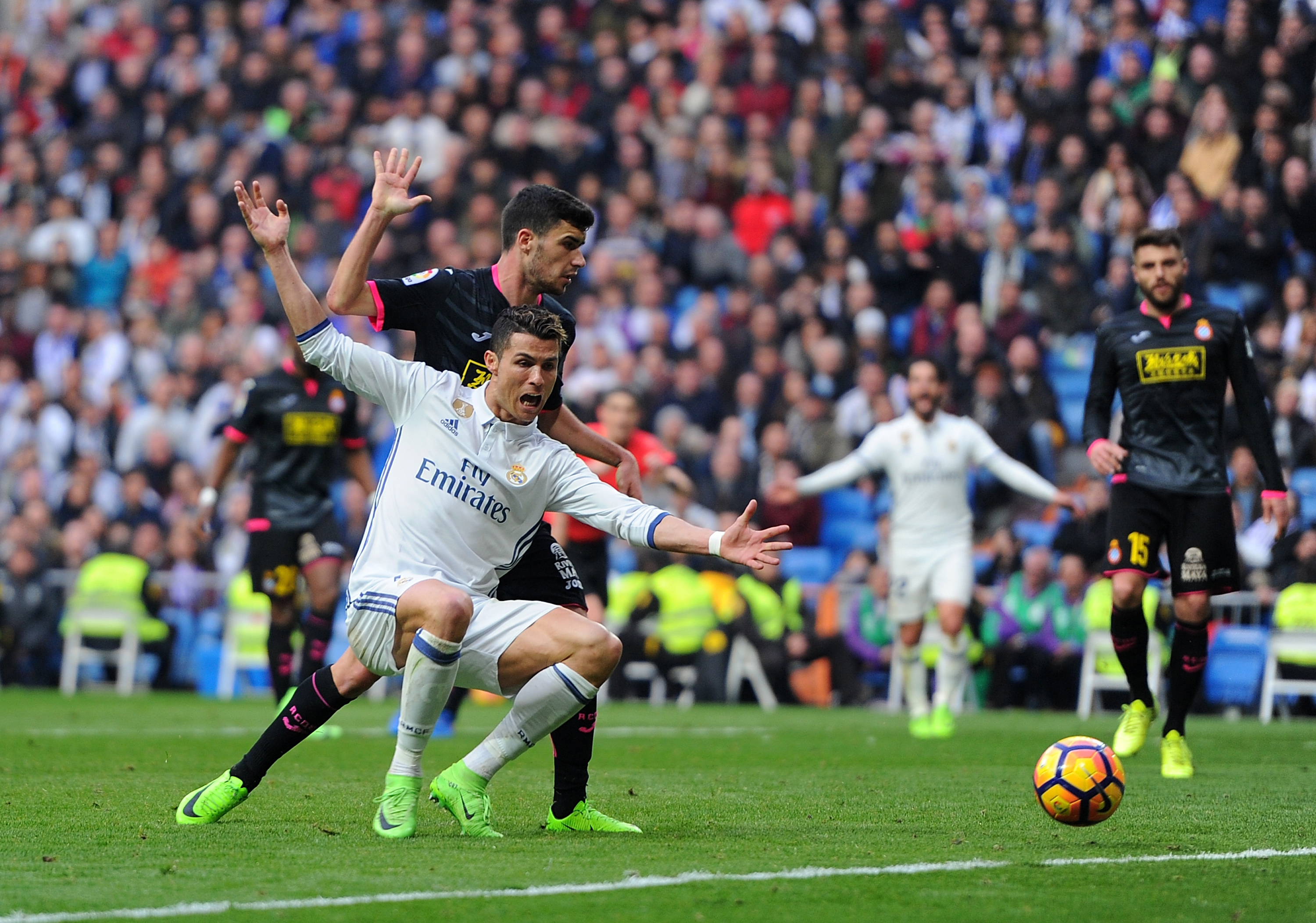 MADRID, SPAIN - FEBRUARY 18: Cristiano Ronaldo of Real Madrid is tackled by Aaron Martin of RCD Espanyol during the La Liga match between Real Madrid CF and RCD Espanyol at the Bernabeu stadium on February 18, 2017 in Madrid, Spain. (Photo by Denis Doyle/Getty Images)