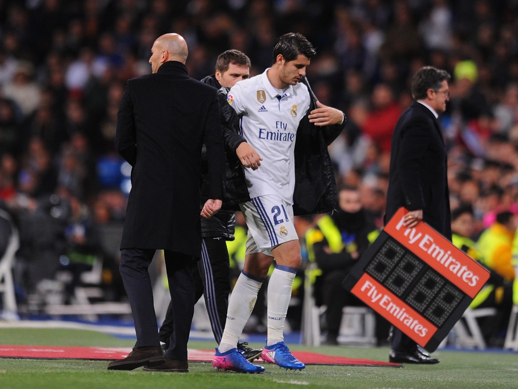 MADRID, SPAIN - MARCH 12: Alvaro Morata of Real Madrid walks past his head coach Zinedine Zidane after coming off during the La Liga match between Real Madrid CF and Real Betis Balompie at Estadio Santiago Bernabeu on March 12, 2017 in Madrid, Spain. (Photo by Denis Doyle/Getty Images)