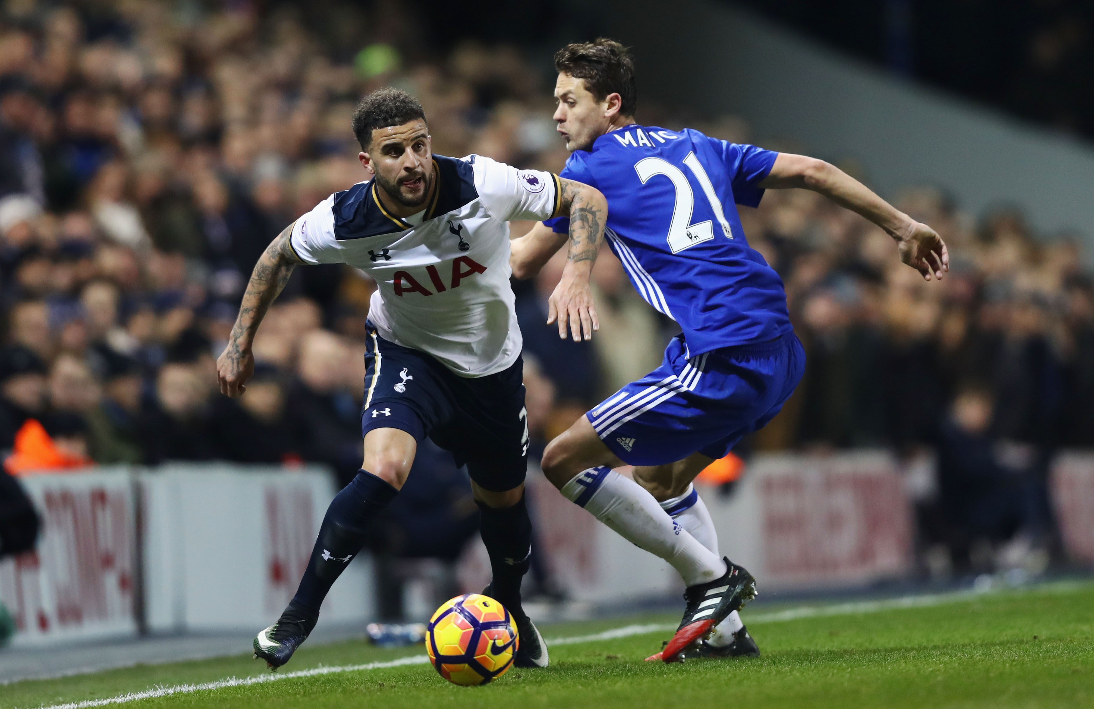 LONDON, ENGLAND - JANUARY 04: Kyle Walker of Tottenham Hotspur (L) takes the ball past Nemanja Matic of Chelsea (R) during the Premier League match between Tottenham Hotspur and Chelsea at White Hart Lane on January 4, 2017 in London, England. (Photo by Clive Rose/Getty Images)
