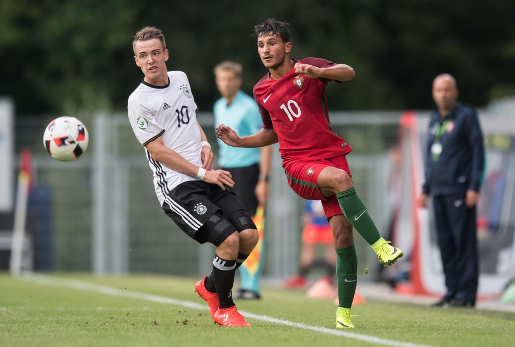 GROSSASPACH, GERMANY - JULY 14: Joao Carvalho of Portugal (R) is challenged by Max Besuschkow of Germany during the UEFA Under19 European Championship match between U19 Germany and u19 Portugal at mechatronik Arena on July 14, 2016 in Grossaspach, Germany. (Photo by Daniel Kopatsch/Bongarts/Getty Images)