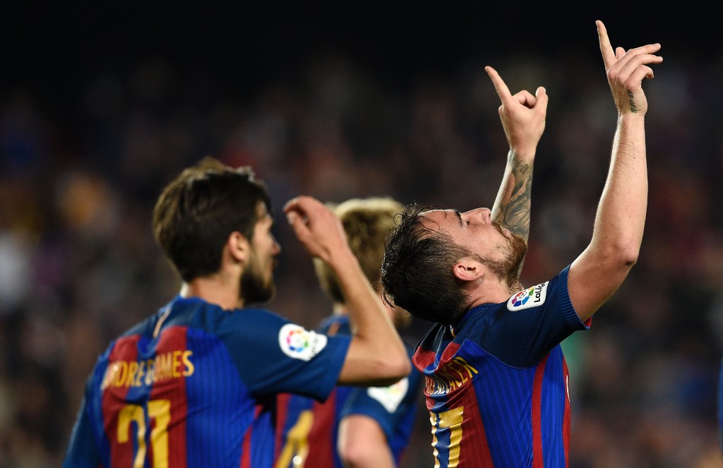 Barcelona's forward Paco Alcacer (R) celebrates a goal during the Spanish league football match FC Barcelona vs Real Sociedad at the Camp Nou stadium in Barcelona on April 15, 2017. / AFP PHOTO / LLUIS GENE (Photo credit should read LLUIS GENE/AFP/Getty Images)