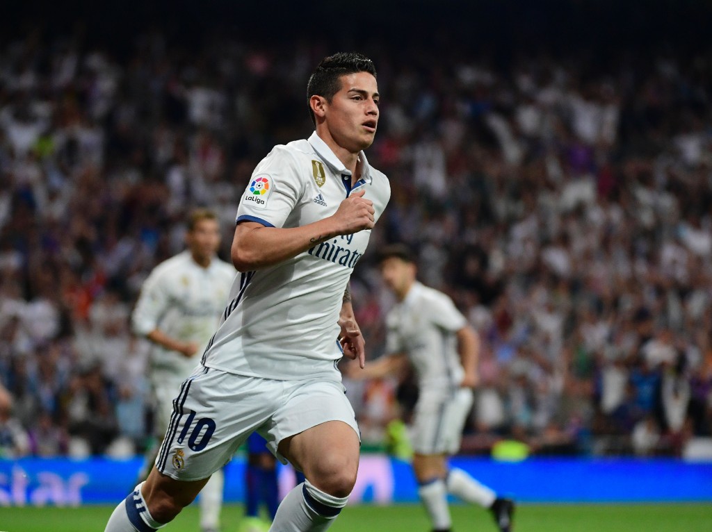 Real Madrid's Colombian midfielder James Rodriguez celebrates a goal during the Spanish league football match Real Madrid CF vs FC Barcelona at the Santiago Bernabeu stadium in Madrid on April 23, 2017. / AFP PHOTO / PIERRE-PHILIPPE MARCOU (Photo credit should read PIERRE-PHILIPPE MARCOU/AFP/Getty Images)