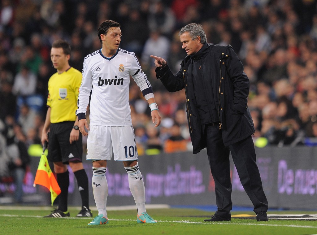 MADRID, SPAIN - DECEMBER 16: Real Madrid CF head coach Jose Mourinho talks with Mesut Ozil of Real Madrid during the La Liga match between Real Madrid CF and RCD Espanyol at estadio Santiago Bernabeu on December 16, 2012 in Madrid, Spain. (Photo by Denis Doyle/Getty Images)