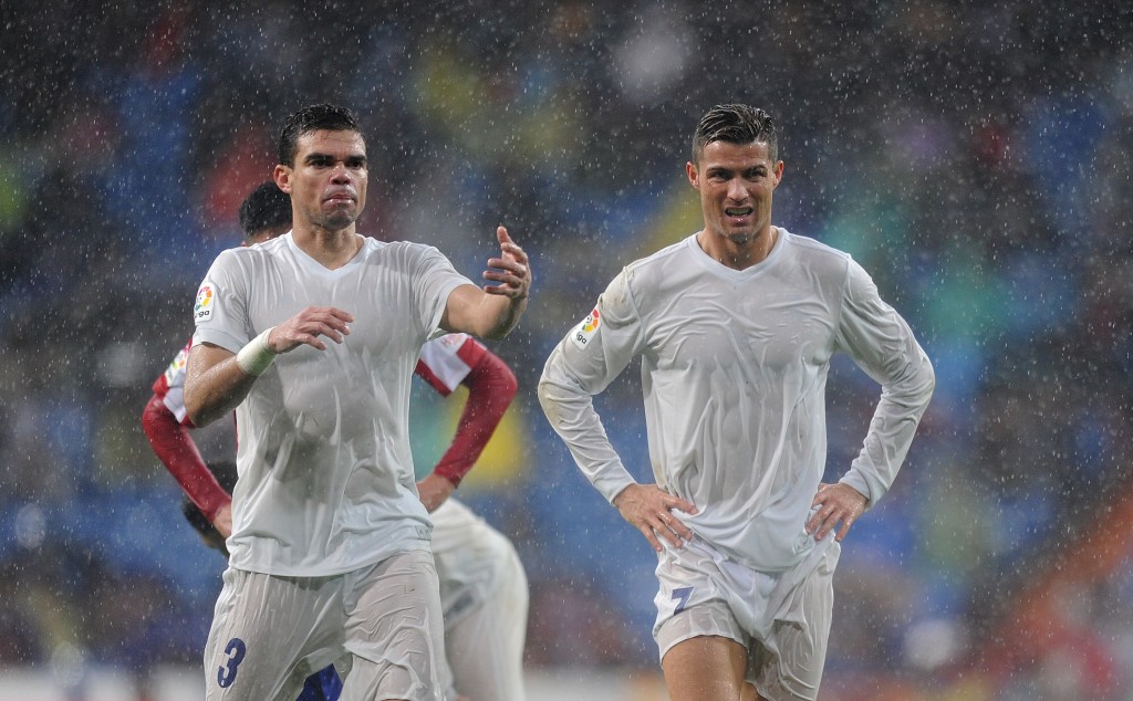 MADRID, SPAIN - NOVEMBER 26: Cristiano Ronaldo of Real Madrid reacts with Pepe during the La Liga match between Real Madrid CF and Real Sporting de Gijon at Estadio Santiago Bernabeu on November 26, 2016 in Madrid, Spain. (Photo by Denis Doyle/Getty Images)