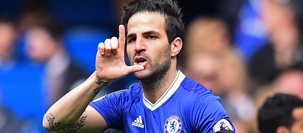 Chelsea's Spanish midfielder Cesc Fabregas celebrates after scoring the opening goal of the English Premier League football match between Chelsea and Crystal Palace at Stamford Bridge in London on April 1, 2017. / AFP PHOTO / Glyn KIRK / RESTRICTED TO EDITORIAL USE. No use with unauthorized audio, video, data, fixture lists, club/league logos or 'live' services. Online in-match use limited to 75 images, no video emulation. No use in betting, games or single club/league/player publications. / (Photo credit should read GLYN KIRK/AFP/Getty Images)