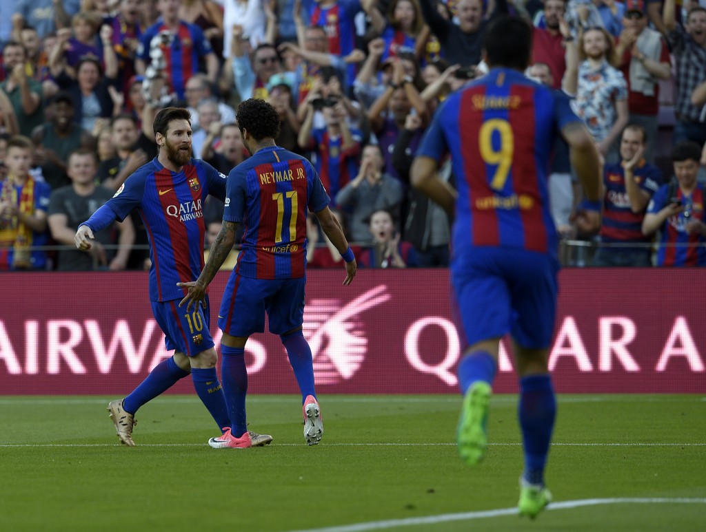 Barcelona's Argentinian forward Lionel Messi (L) celebrates with Barcelona's Brazilian forward Neymar after scoring a goal during the Spanish league football match FC Barcelona vs Villarreal CF at the Camp Nou stadium in Barcelona on May 6, 2017. / AFP PHOTO / LLUIS GENE (Photo credit should read LLUIS GENE/AFP/Getty Images)