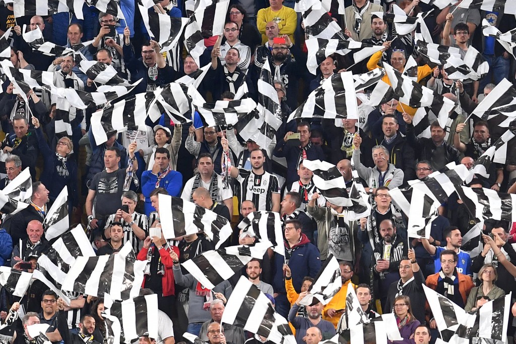 Juventus' fans celebrate at the end of the UEFA Champions League semi final second leg football match Juventus vs Monaco, on May 9, 2017 at the Juventus stadium in Turin. Juventus secured their place in the final of the Champions League on Tuesday after beating Monaco 2-1 in their semi-final second leg to win the tie 4-1 on aggregate. / AFP PHOTO / Alberto PIZZOLI (Photo credit should read ALBERTO PIZZOLI/AFP/Getty Images)