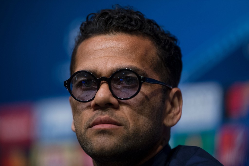 Juventus' Brazilian defender Dani Alves gestures during a press conference at the Camp Nou stadium in Barcelona on April 18, 2017 on the eve of the UEFA Champions League quarter-final second leg football match FC Barcelona vs Juventus. / AFP PHOTO / Josep LAGO (Photo credit should read JOSEP LAGO/AFP/Getty Images)