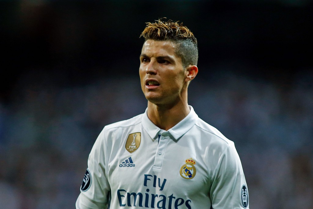 Real Madrid's portuguese forward Cristiano Ronaldo looks on during the UEFA Champions League semi-final first leg football match Real Madrid vs Atletico de Madrid at the Santiago Bernabeu stadium in Madrid on May 2, 2017. / AFP PHOTO / OSCAR DEL POZO (Photo credit should read OSCAR DEL POZO/AFP/Getty Images)