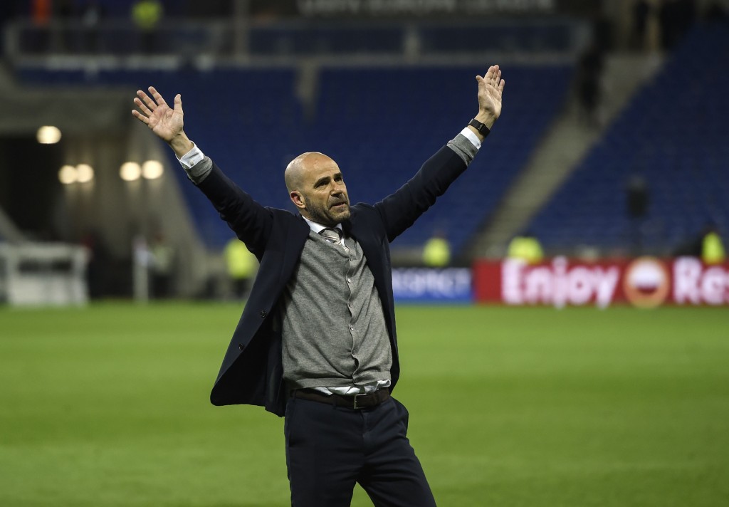 Ajax' Dutch head coach Peter Bosz celebrates with supporters after winning the UEFA Europa League semi-final football match between Olympique Lyonnais (OL) against Ajax Amsterdam, on May 11, 2017 at the Parc Olympique Lyonnais stadium in Décines-Charpieu near Lyon, southeastern France. / AFP PHOTO / PHILIPPE DESMAZES (Photo credit should read PHILIPPE DESMAZES/AFP/Getty Images)
