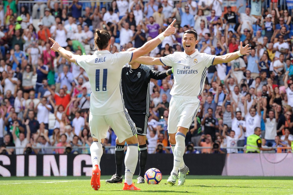 MADRID, SPAIN - SEPTEMBER 10: Cristiano Ronaldo of Real Madrid celebrates with Gareth Bale after scoring opening goal during the La Liga match between Real Madrid CF and CA Osasuna at Estadio Santiago Bernabeu on September 10, 2016 in Madrid, Spain. (Photo by Denis Doyle/Getty Images)