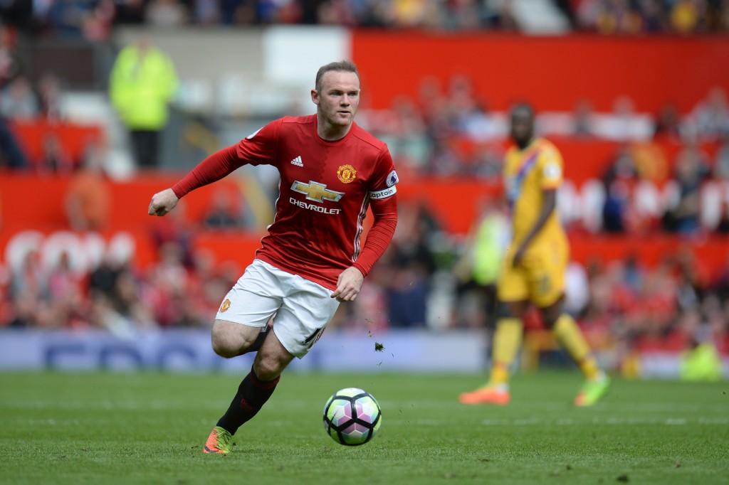 Manchester United's English striker Wayne Rooney runs with the ball during the English Premier League football match between Manchester United and Cyrstal Palace at Old Trafford in Manchester, north west England, on May 21, 2017. / AFP PHOTO / Oli SCARFF / RESTRICTED TO EDITORIAL USE. No use with unauthorized audio, video, data, fixture lists, club/league logos or 'live' services. Online in-match use limited to 75 images, no video emulation. No use in betting, games or single club/league/player publications. / (Photo credit should read OLI SCARFF/AFP/Getty Images)