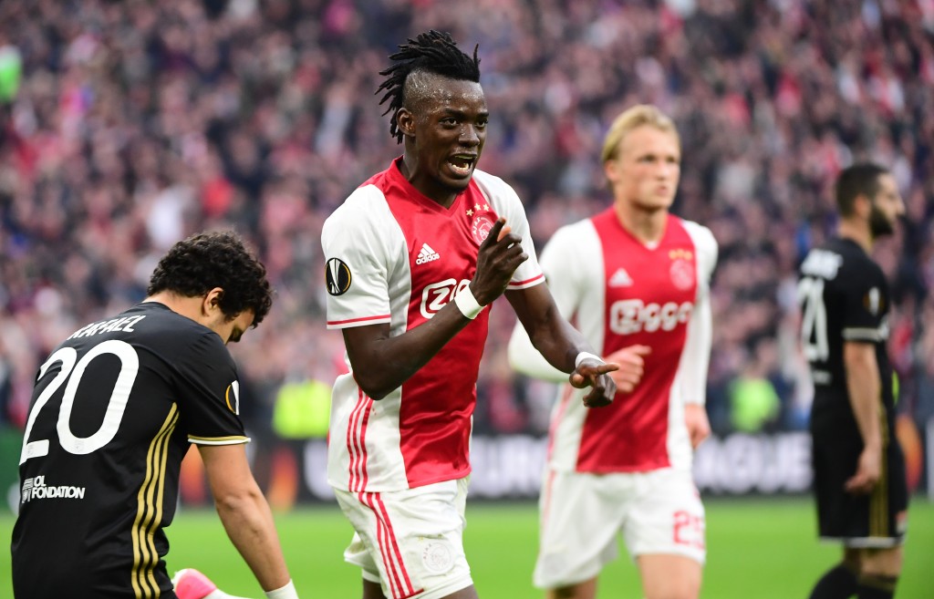 Ajax forward Bertrand Traoré (C) reacts after fourth goal during UEFA Europa League semi-final, first leg, Ajax Amsterdam v Olympique Lyonnais on May 3, 2017 in Amsterdam. / AFP PHOTO / Emmanuel DUNAND (Photo credit should read EMMANUEL DUNAND/AFP/Getty Images)