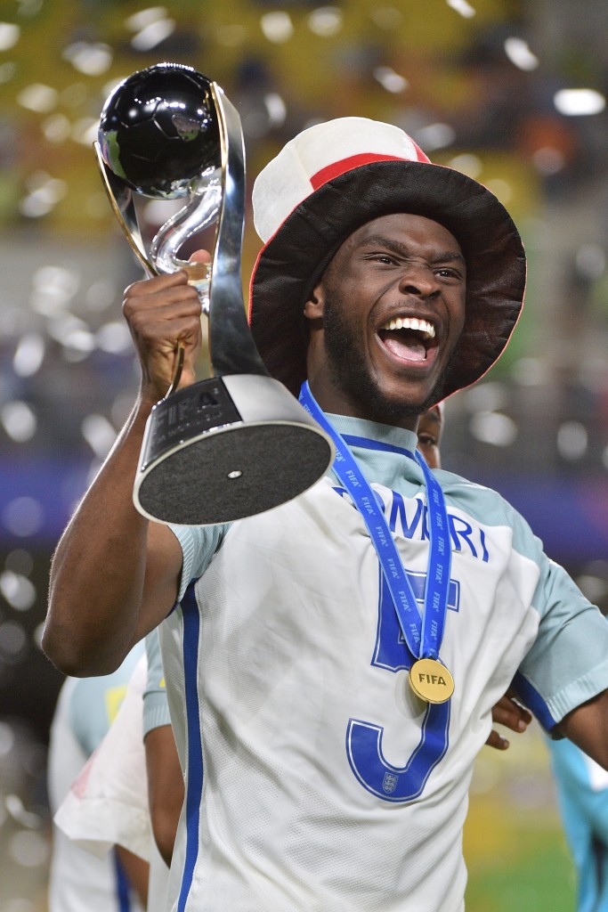 England's defender Fikayo Tomori celebrates with the trophy during the awards ceremony after winning the U-20 World Cup final football match between England and Venezuela in Suwon on June 11, 2017. / AFP PHOTO / KIM DOO-HO (Photo credit should read KIM DOO-HO/AFP/Getty Images)