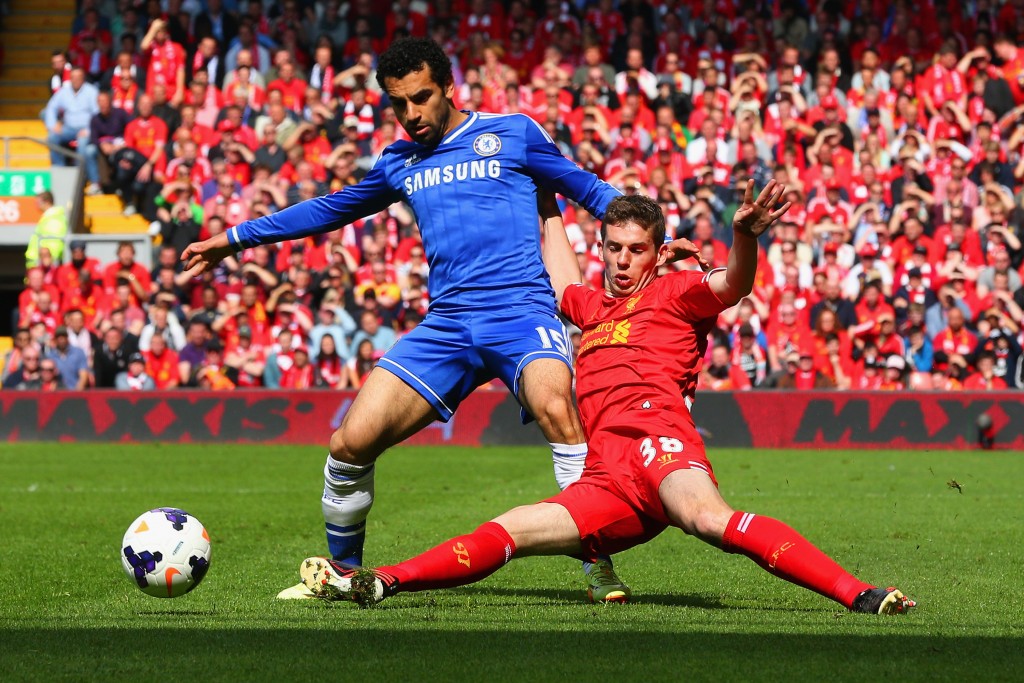 LIVERPOOL, ENGLAND - APRIL 27: Mohamed Salah of Chelsea is tackled by Jon Flanagan of Liverpool during the Barclays Premier League match between Liverpool and Chelsea at Anfield on April 27, 2014 in Liverpool, England. (Photo by Clive Brunskill/Getty Images)